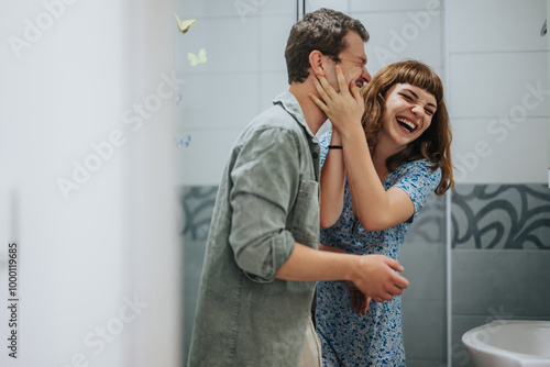 Fotografie Joyful couple preparing for a night out, filled with laughter and playful moments in a lively atmosphere