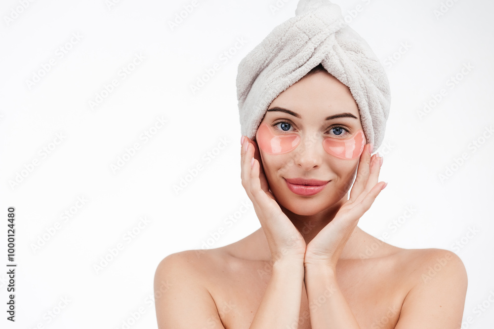 Close up of caucasian girl with natural no makeup, wears silicone under eye patches and smiling happy, using skincare products from dark circles, white background Close up of caucasian girl with natural no makeup, wears silicone under eye patches and smiling happy, using skincare products from dark circles, white background