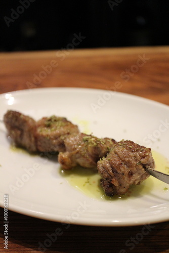 Italian cuisine: spiedino di agnello (grilled lamb skewer) photo