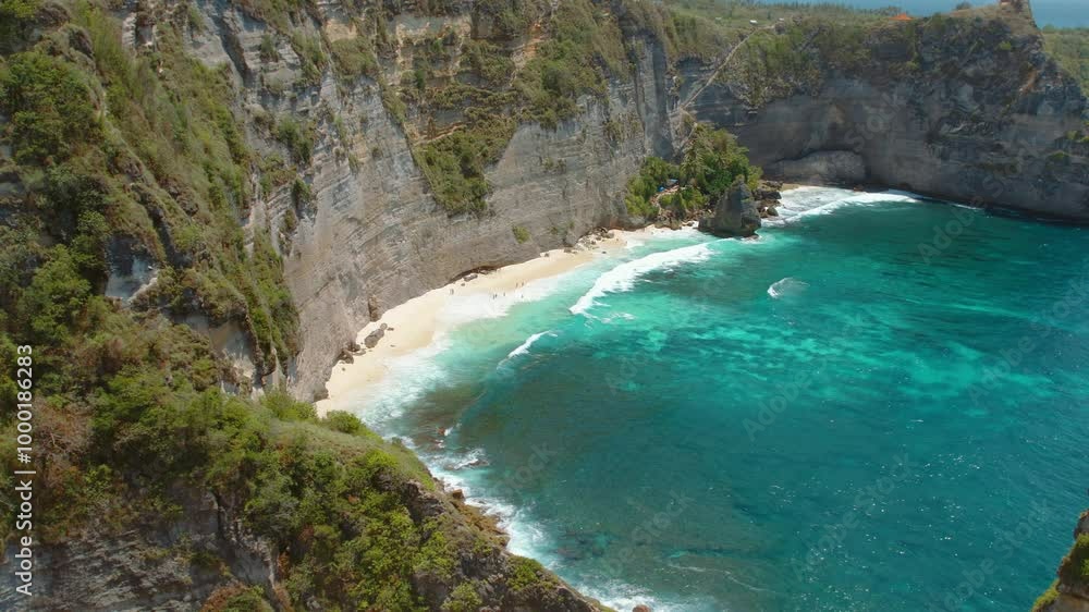 Aerial view of rugged cliffs and turquoise ocean along Diamond beach on coastline of Nusa Penida Bali Aerial view of rugged cliffs and turquoise ocean along Diamond beach on coastline of Nusa Penida Bali