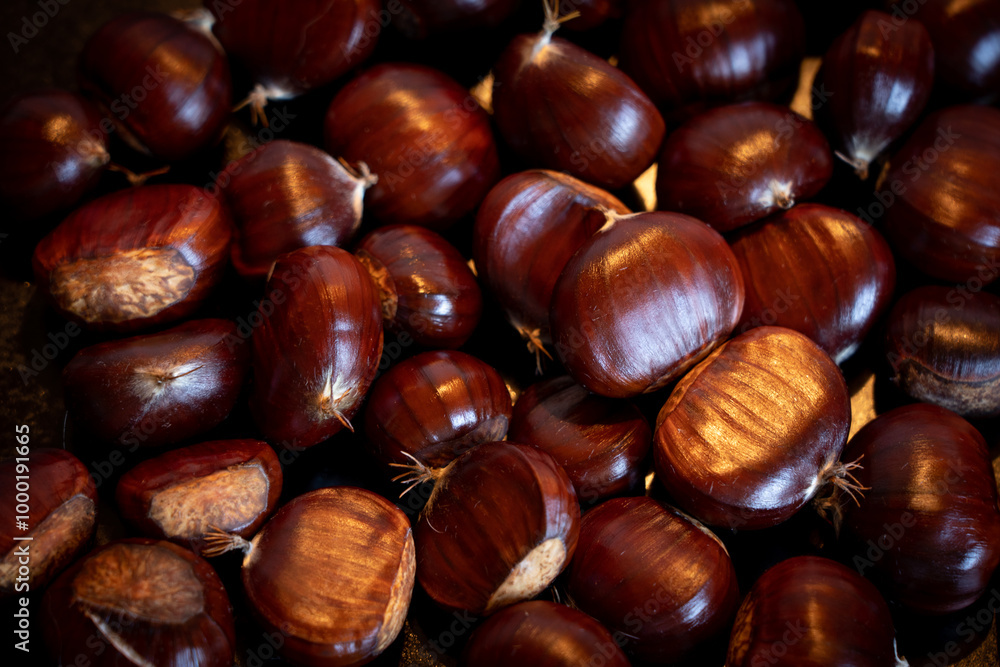 Close up of chestnuts on a frying pan Close up of chestnuts on a frying pan
