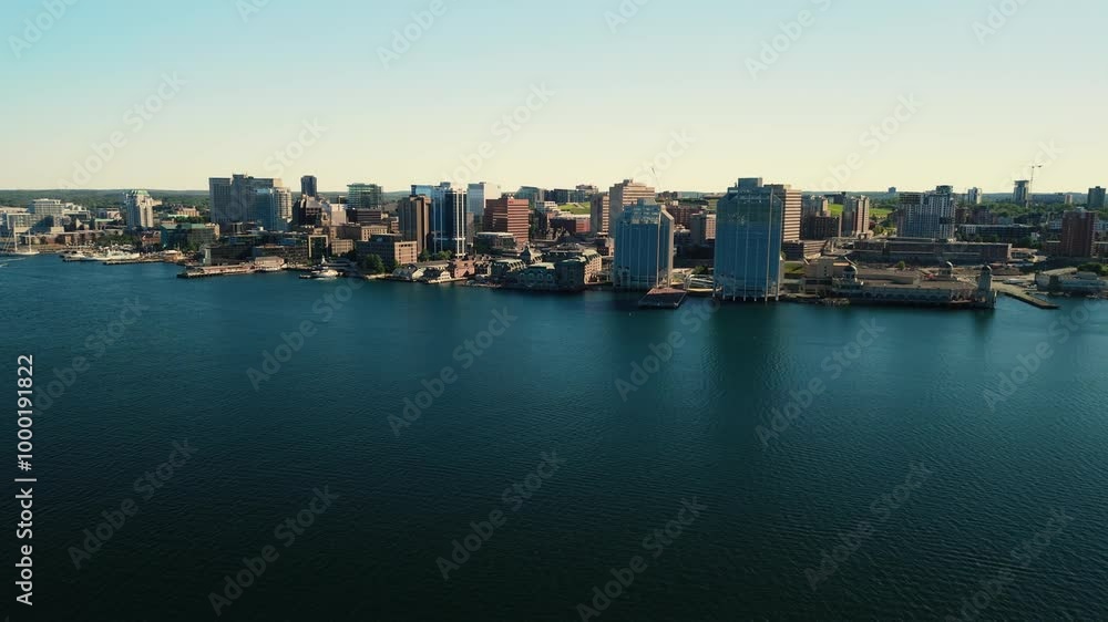 A Breathtaking Drone View Of Halifax Skyscrapers, Glowing In The Golden Light Of A Summer Sunset, Creating A Beautiful Cinematic Scene. Nova Scotia, Canada. A Breathtaking Drone View Of Halifax Skyscrapers, Glowing In The Golden Light Of A Summer Sunset, Creating A Beautiful Cinematic Scene. Nova Scotia, Canada.