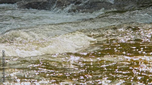 Waters of the Ganaraska River near Corbett's Dam, Port Hope, Ontario, Canada. These upstream waters used by Salmon fish to migrate for spawning during Autumn season. photo