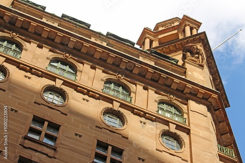 Sandstone building with round windows
