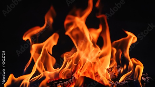 Fire and reflection on black background. Yellow and orange flame, fiery background