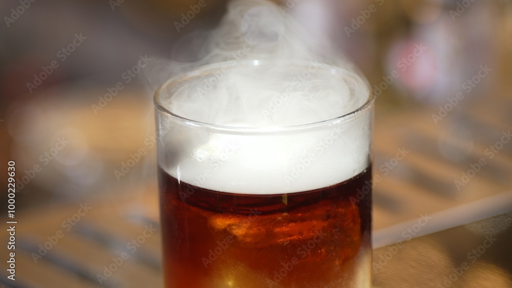Focusing serving mist smoky classical in Old fashioned of whiskey cocktail presentation on bokeh background recommending special welcome tasty creative advertisement drink at beverage bar. Vinosity. Focusing serving mist smoky classical in Old fashioned of whiskey cocktail presentation on bokeh background recommending special welcome tasty creative advertisement drink at beverage bar. Vinosity.