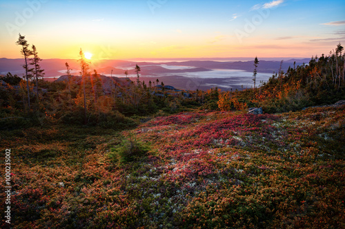Majestic sunrise over mountains of Charlevoix, and the vibrant colors of Fall, QC, Canada