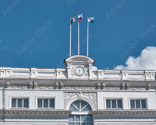 Facade of Sarapul city administration building, Russia. Three flags - Russia, Udmurt, Sarapul photo