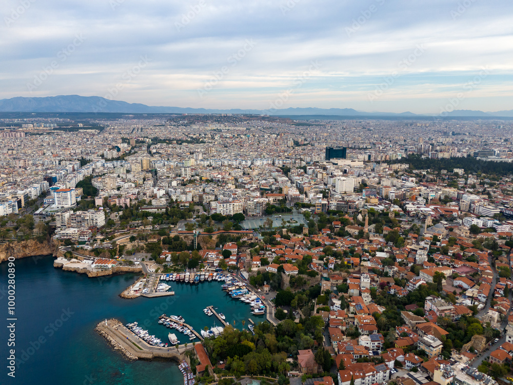 Obraz premium Aerial View of Residential District of City at Sea Coast. Old Town Marina in Small Bay. Antalya, Turkey.