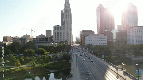 high quality 4K drone footage of city skyline in the morning of the leveque tower during rush hour with the sun reflecting off the buildings photo