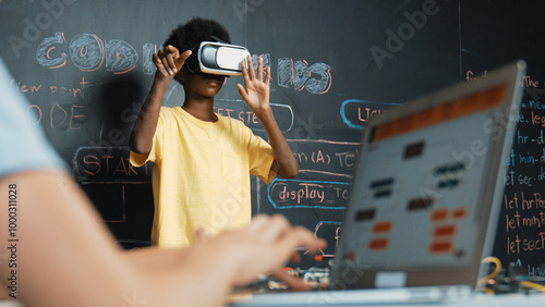 Obraz na plátně Closeup of school girl hand coding program while african student using VR interact with metaworld