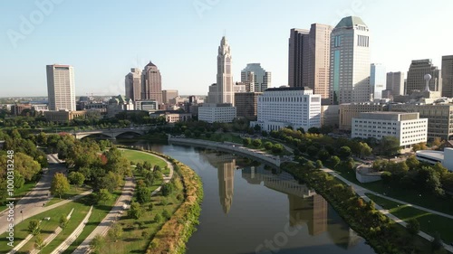 4k drone footage of a city reflecting off the downtown river in the morning with cinematic lighting in columbus ohio 2024 photo