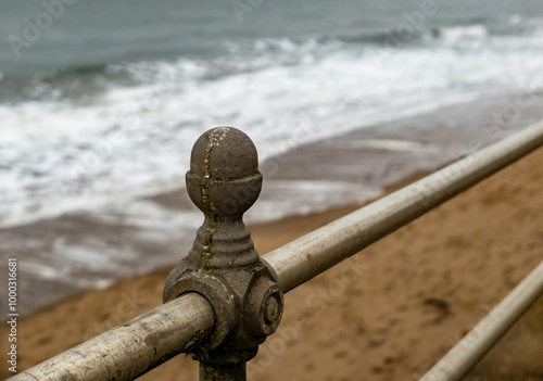 Close up of metal railing on the beach