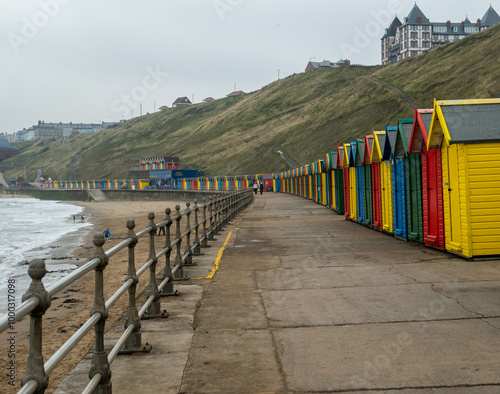 Colourful beach huts on Whitby promenade