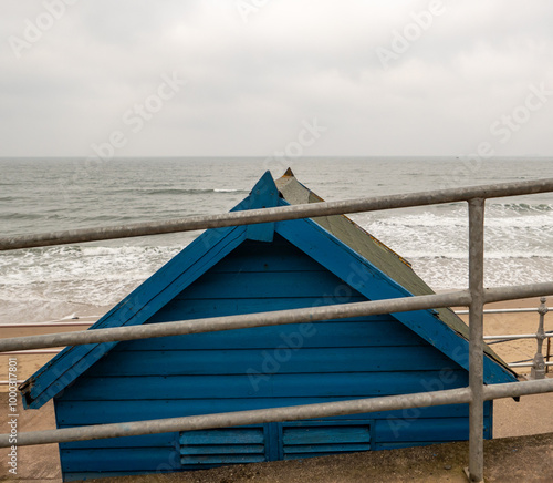 Blue beach hut on the coast