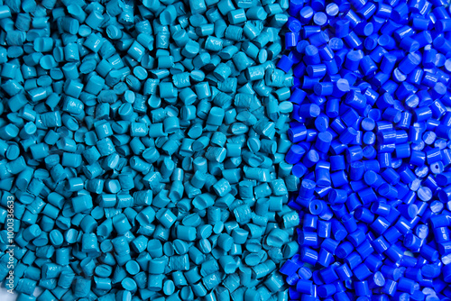 Blue and turquoise masterbatch granules on a white background, this polymer is a colorant for products in the plastics industry