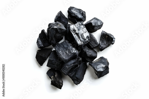 top view of black coals on white background