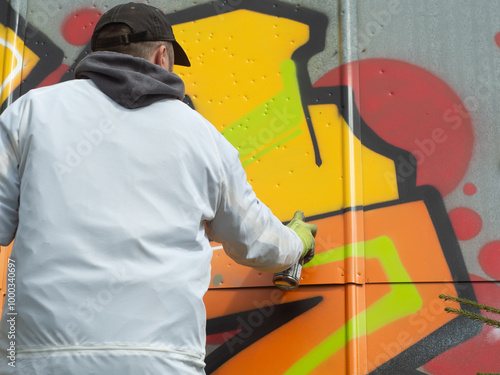 Photography moscow russia 08 06 2023 urban artist paint graffiti on the wall, vandal paint w