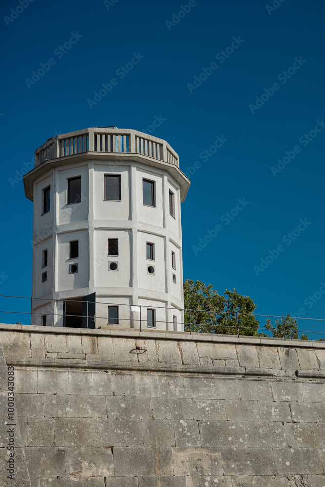 Tower on the top of fortress in Pula, observation tower on the edge of a city wall. Beautiful blue skies over the fort in Pula, Croatia Tower on the top of fortress in Pula, observation tower on the edge of a city wall. Beautiful blue skies over the fort in Pula, Croatia