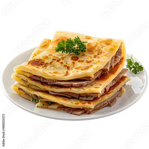 Delicious stack of crepes with savory meat, topped with fresh parsley, served on a white plate