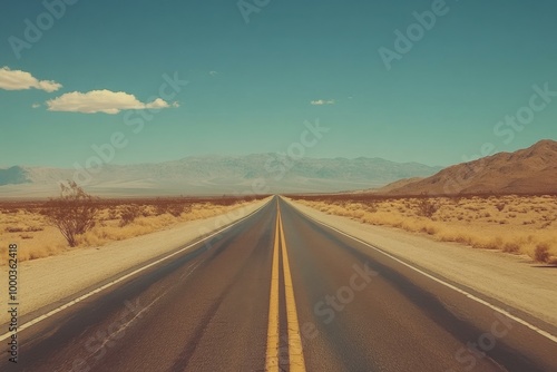 Stunning Desert Road Under Clear Blue Sky - Perfect for Travel Marketing, Road Trip Inspiration, and Outdoor Adventure Promotion