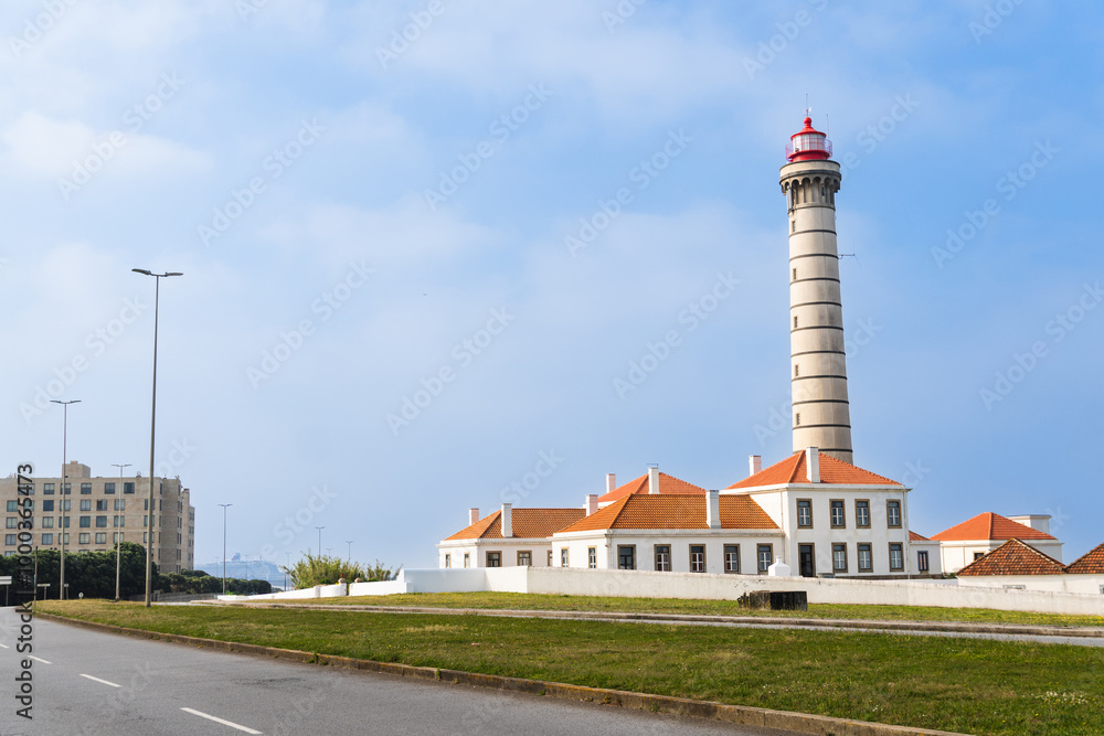 View of lighthouse, typical Portuguese architecture, with nice details and very particular framing, blue sky as background, located in Leça da Palmeira, Porto, Portugal. Matosinhos. Leça Beach View of lighthouse, typical Portuguese architecture, with nice details and very particular framing, blue sky as background, located in Leça da Palmeira, Porto, Portugal. Matosinhos. Leça Beach