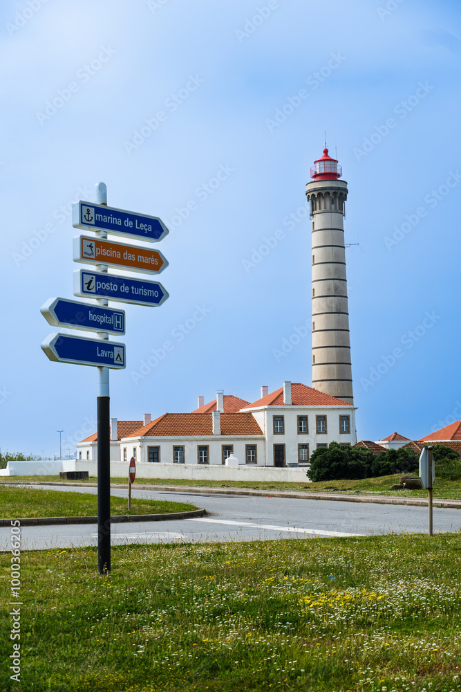 Obraz premium View of lighthouse, typical Portuguese architecture, with nice details and very particular framing, blue sky as background, located in Leça da Palmeira, Porto, Portugal. Matosinhos. Leça Beach