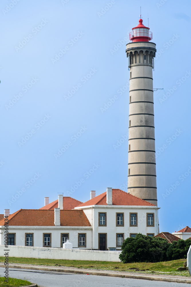 Obraz premium View of lighthouse, typical Portuguese architecture, with nice details and very particular framing, blue sky as background, located in Leça da Palmeira, Porto, Portugal. Matosinhos. Leça Beach