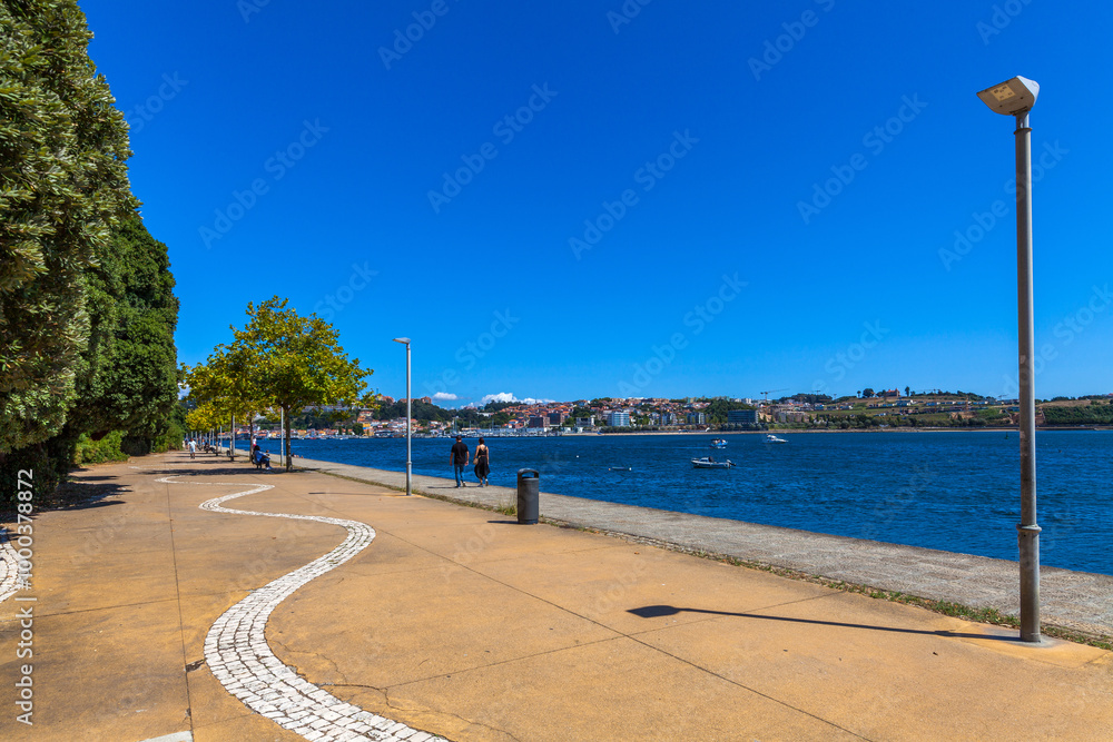 Fototapeta premium A peaceful riverside promenade in Porto, Portugal