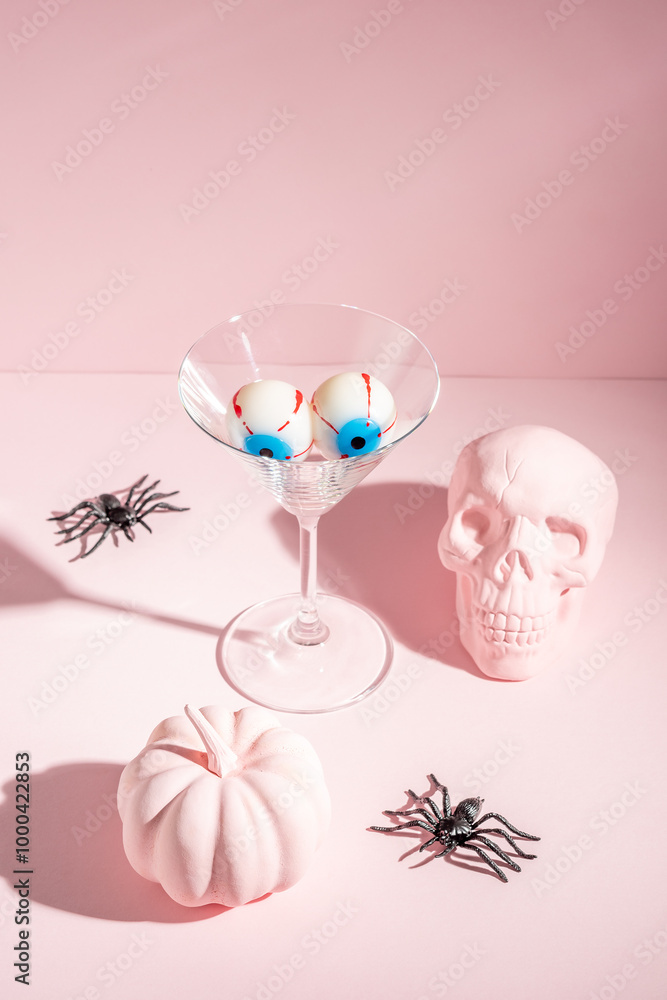 Creative Halloween layout with eyeballs in martini glass. Minimal holiday concept. Creative Halloween layout with eyeballs in martini glass. Minimal holiday concept.