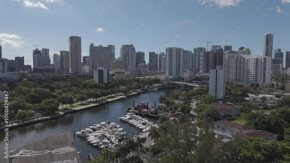 aerial shot across the waterway and buildings at sunset in downtown - Miami, Florida
aerial shot across the waterway and buildings at sunset in downtown - Miami, Florida