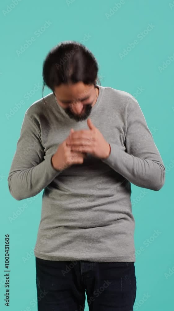 Vertical video Portrait of cheerful man laughing hard, amused by funny joke, studio background. Happy Arab person chuckling and giggling, delighted by comedy, feeling entertained, camera A Vertical video Portrait of cheerful man laughing hard, amused by funny joke, studio background. Happy Arab person chuckling and giggling, delighted by comedy, feeling entertained, camera A