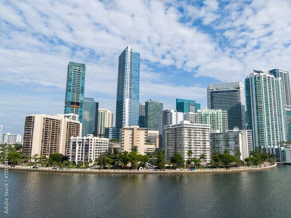 Downtown city skyline and calm ocean waterfront of Miami at sunrise, Florida, United States. Downtown city skyline and calm ocean waterfront of Miami at sunrise, Florida, United States.
