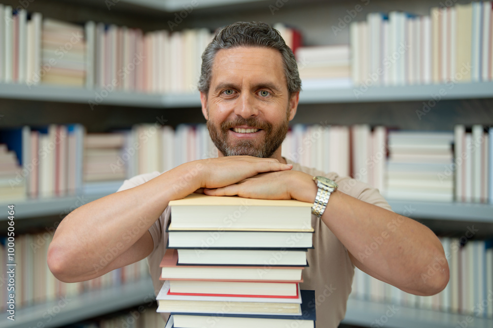 Teachers day. Funny teacher hold many books. Crazy teacher with books. Excited teacher in school book library. Teacher from university exam. College teachers. Teachers day. Funny teacher hold many books. Crazy teacher with books. Excited teacher in school book library. Teacher from university exam. College teachers.