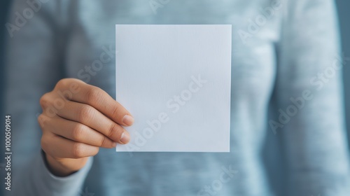 Closeup of a hand sealing an envelope with a mailin ballot, mailin voting, voting from home photo