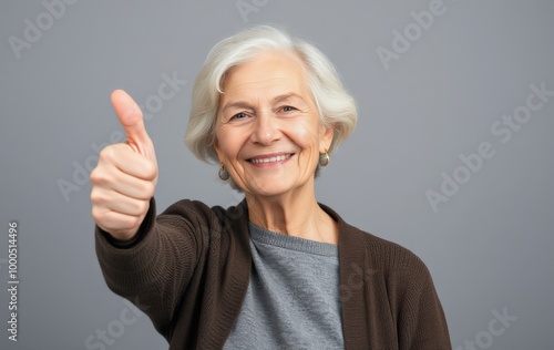 Wallpaper Mural Elderly Woman in Glasses Giving a Confident Thumbs Up Torontodigital.ca