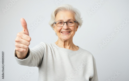 Wallpaper Mural Elderly Woman in Glasses Giving a Confident Thumbs Up Torontodigital.ca