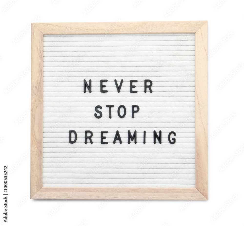 Letter board with phrase Never stop dreaming on white background, top view Letter board with phrase Never stop dreaming on white background, top view