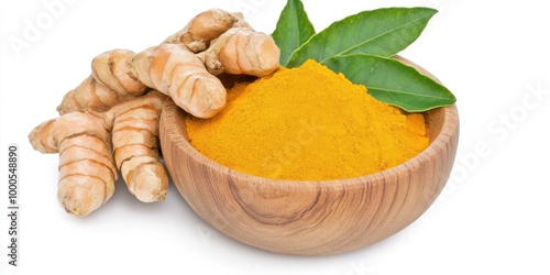 Turmeric Root and Powder in Wooden Bowl with Green Leaves photo