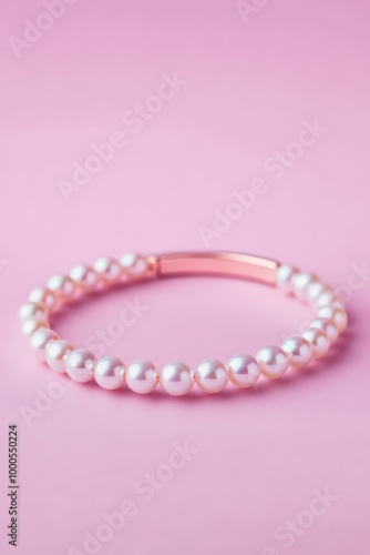 Elegant Pearl Bracelet on Pink Background