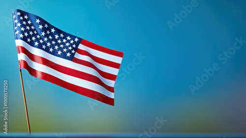 American Flag Waving Against Blue Background