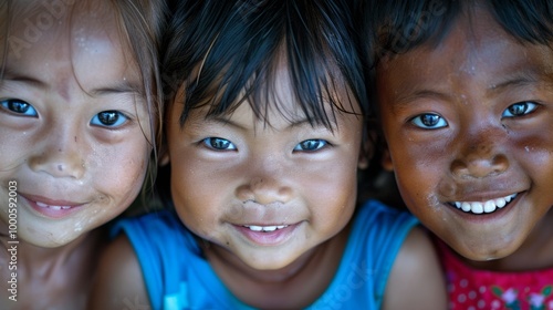 A heartwarming close-up of three children from different ethnic backgrounds