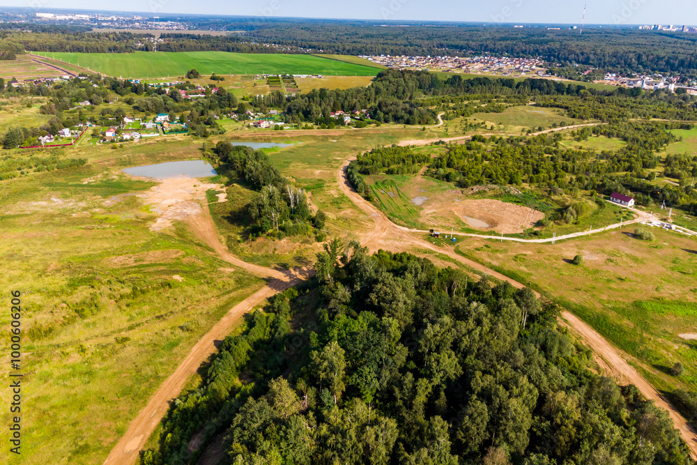 Aerial view of country landscape with houses in green landscape Aerial view of country landscape with houses in green landscape