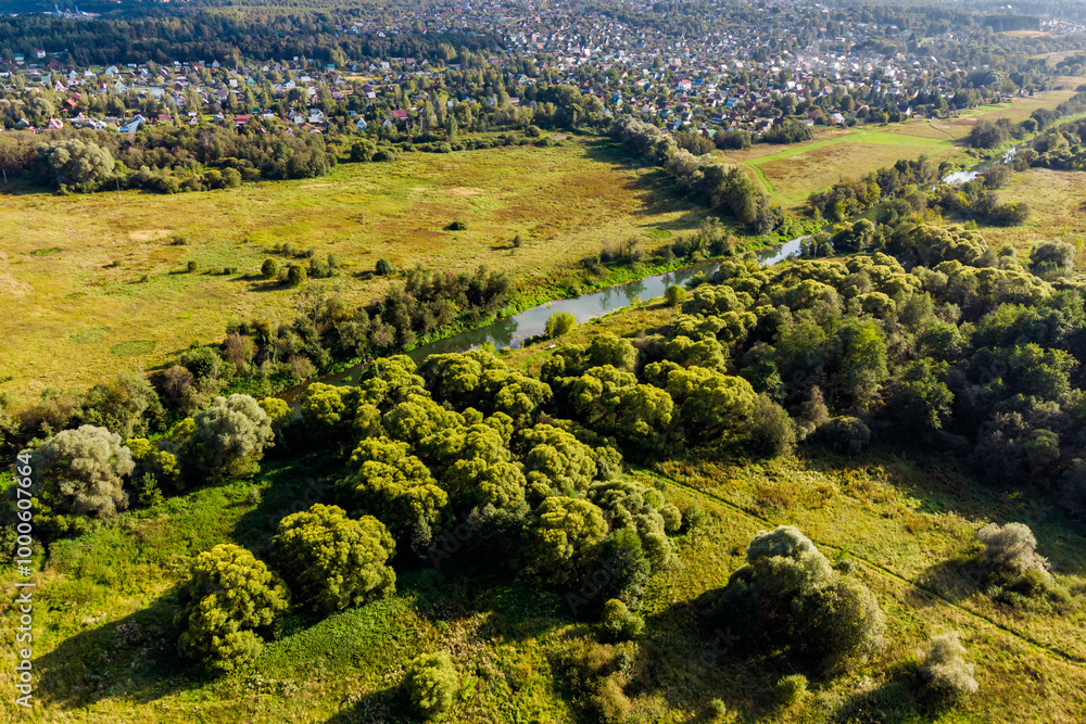 Obraz premium Quadcopter view of a picturesque rural landscape with a small river Luzha. Maloyaroslavetsky district, Kaluga region