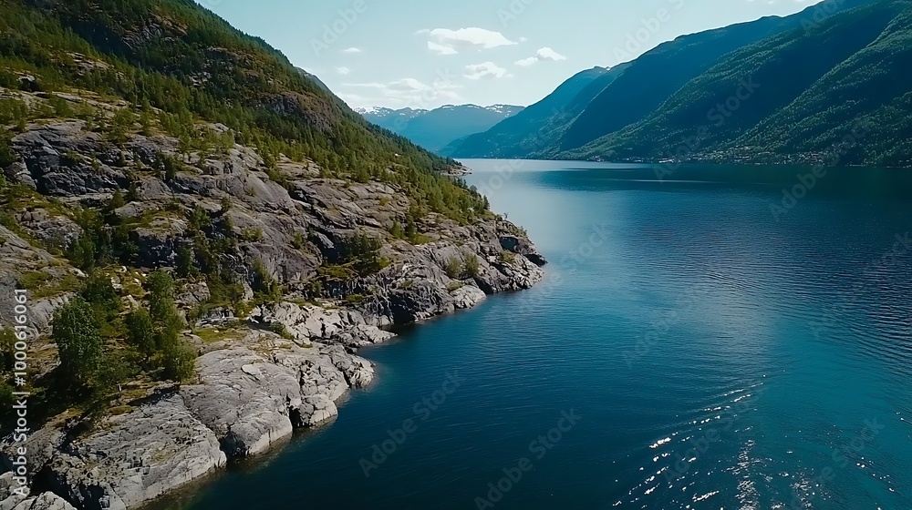 Obraz premium Majestic Fjord Landscape with Mountainous Cliffs and Tranquil Blue Water