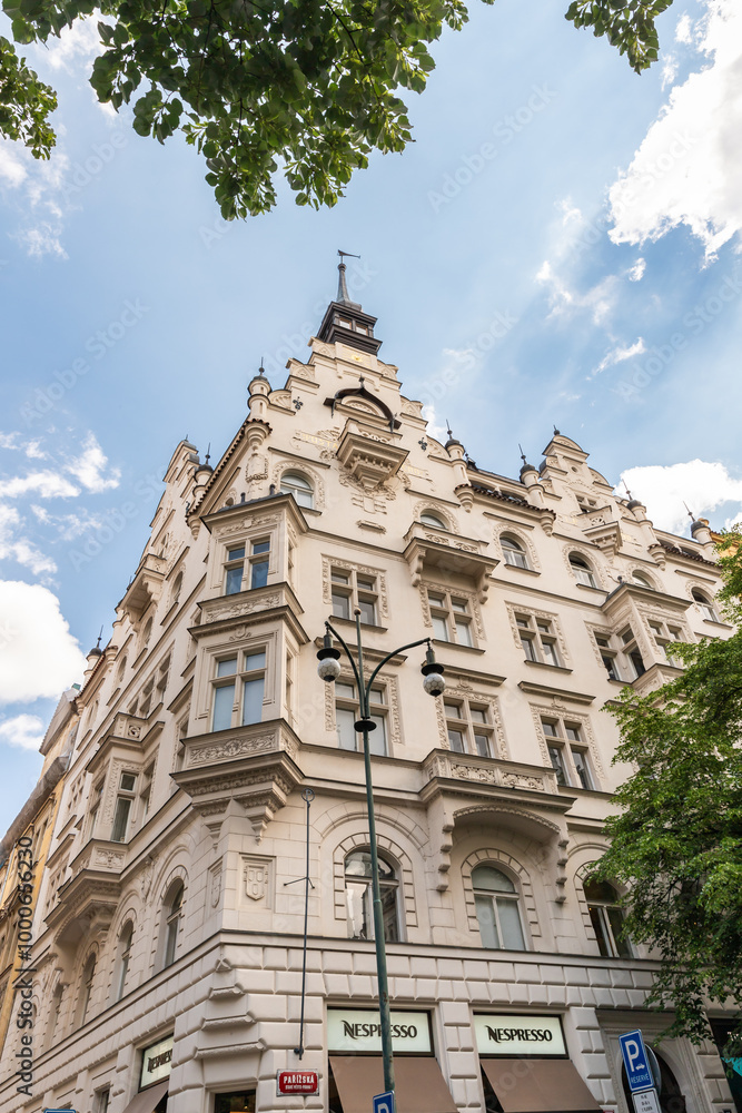 Obraz premium The buildings corner of Kostechna Street and Parisian Street in the old part of Prague in Czech Republic
