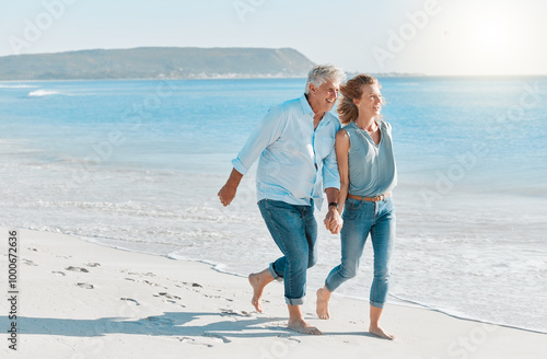 Fotografie Mature couple, running and holding hands with beach for holiday, weekend or outdoor bonding