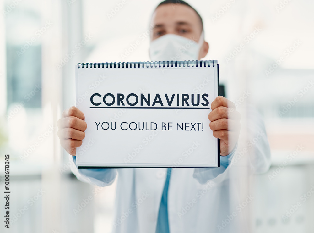Man, doctor and mask with poster for coronavirus, pandemic or viral outbreak at hospital. Male person, medical worker or healthcare employee with sign, alert or message for covid safety or precaution Man, doctor and mask with poster for coronavirus, pandemic or viral outbreak at hospital. Male person, medical worker or healthcare employee with sign, alert or message for covid safety or precaution