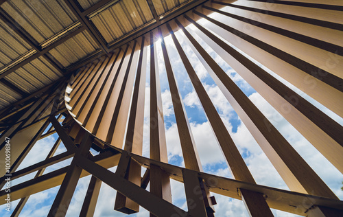 A structure featuring wooden slats on construction site contributing to its architectural style