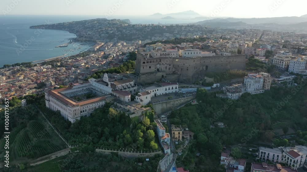 Aerial view from high altitude of the city of Naples, Castel Sant'Elmo, Certosa monastery and Museo di San Martino in summer on a sunny evening at sunset, Campania, Italy, Europe Aerial view from high altitude of the city of Naples, Castel Sant'Elmo, Certosa monastery and Museo di San Martino in summer on a sunny evening at sunset, Campania, Italy, Europe